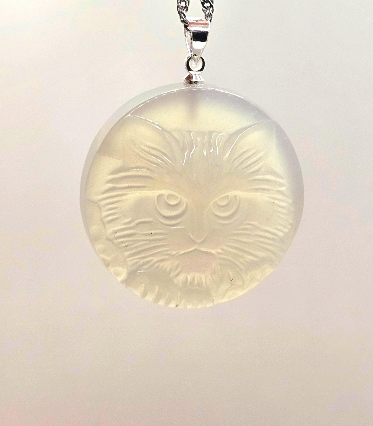 Stone carved cat face pendant in labradorite or moonstone with round crystal design — My Aura Gemstones